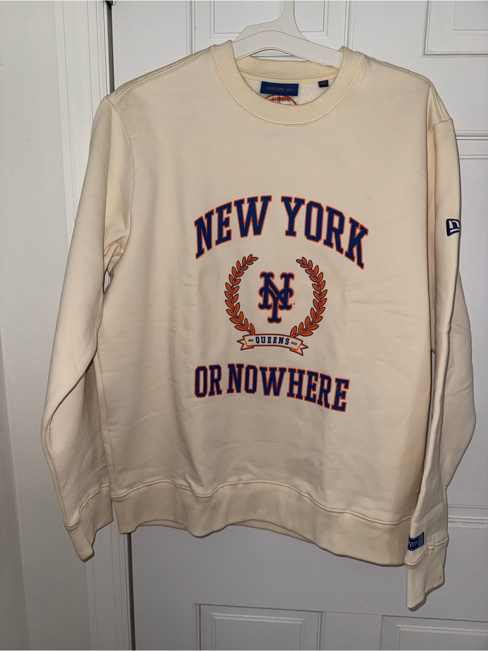 New Era Cream Crewneck Sweatshirt with Navy & Orange New York Graphic